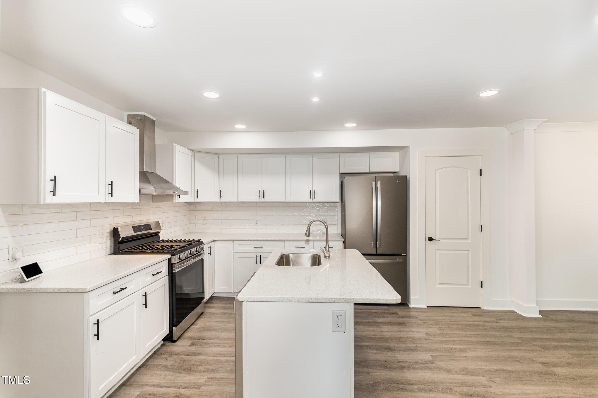 819 Cumberland Street Raleigh, NC 27610 - Photo 10 of 21 a kitchen that has a sink and a stove in it
