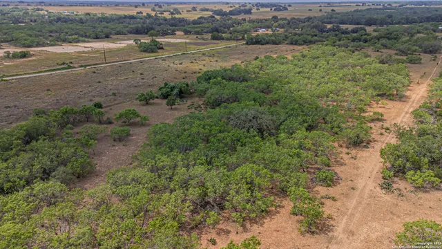 an aerial view of beach and yard