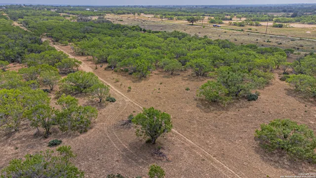 a view of a lake with beach and city view
