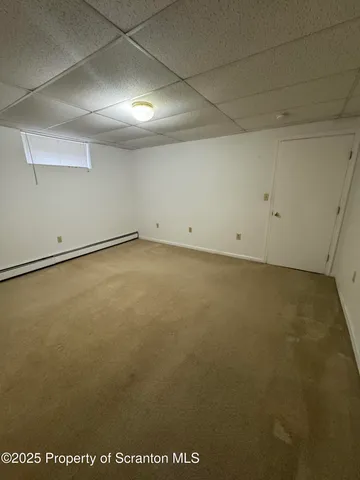 an empty room with a wooden door