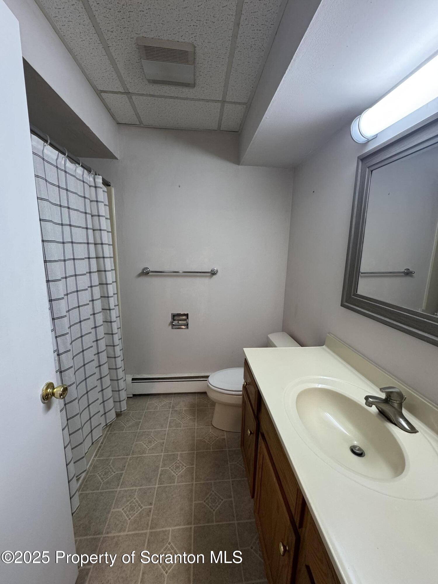 622 Terrace Street, Unit B Dunmore, PA 18512 - Photo 10 of 15 a bathroom with a sink and a mirror