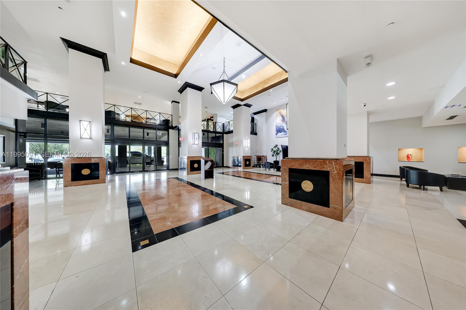 555 Northeast 15th Street, Unit 33G Miami, FL 33132 - Photo 12 of 18 a lobby with furniture and fireplace