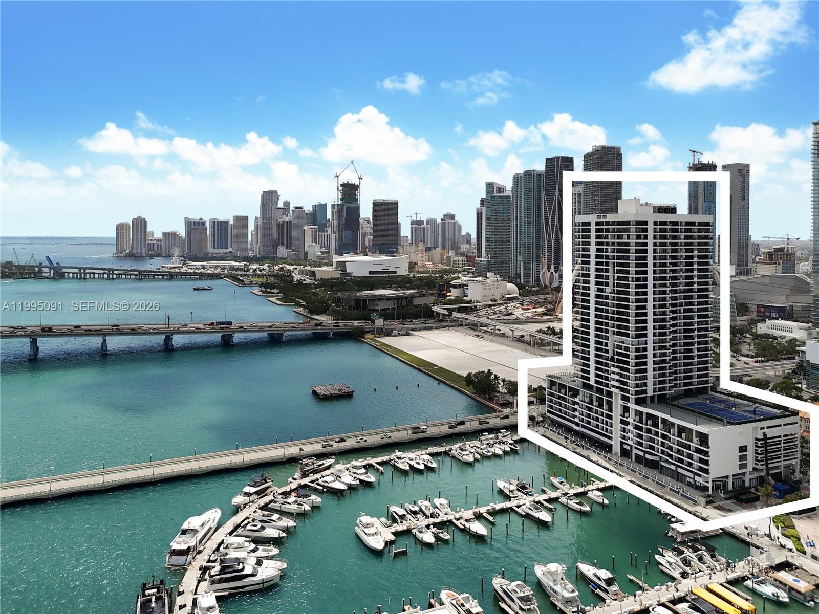 555 Northeast 15th Street, Unit 33G Miami, FL 33132 - Photo 17 of 18 a view of a city with tall buildings