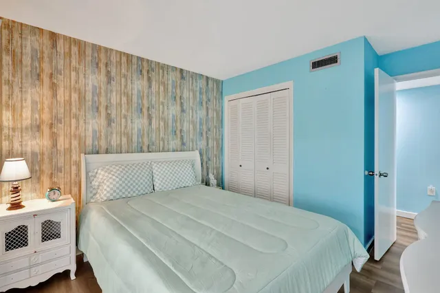 a bedroom with a bed and a cabinets