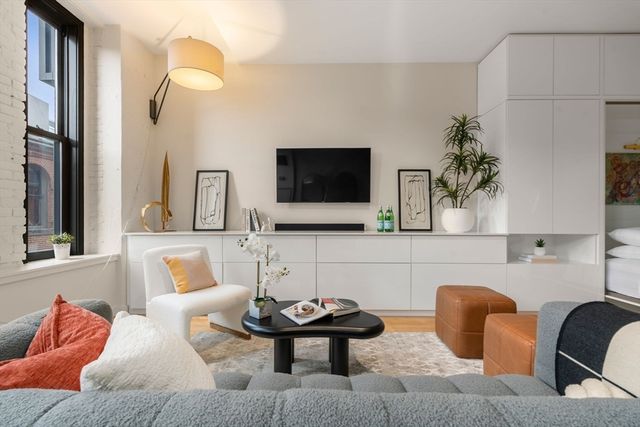 a living room with furniture and a flat screen tv
