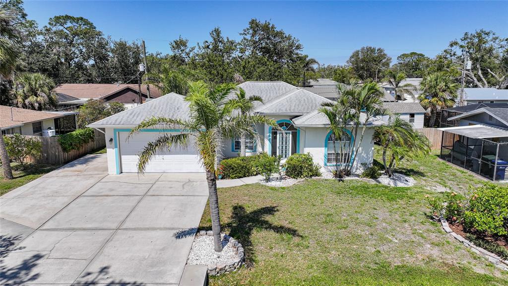 440 Grant Road Venice, FL 34293 - Photo 1 of 1 a front view of a house with a yard