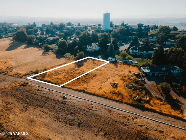 a view of a pool with a bench in front of it