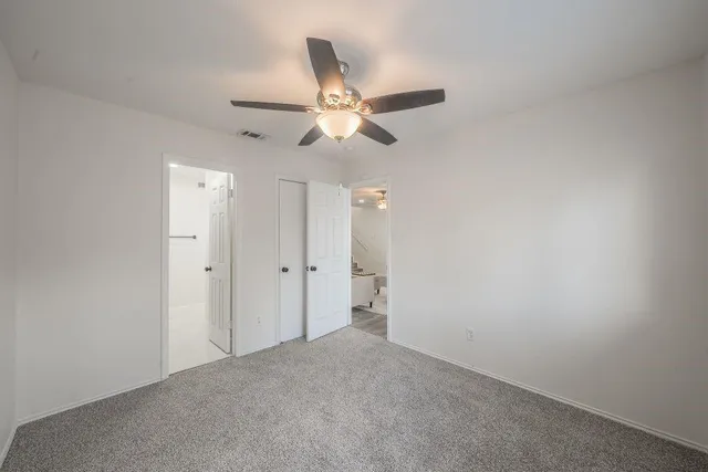 a view of a chandelier fan in a room