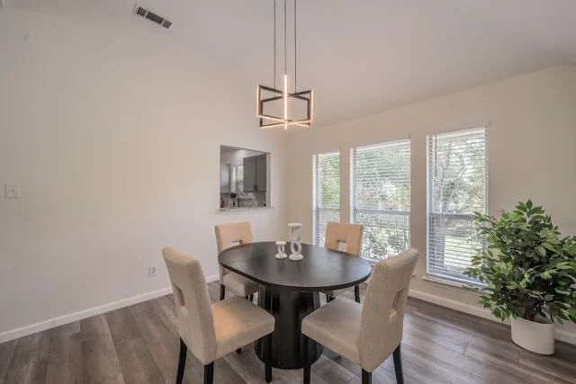 a view of a dining room with furniture window and wooden floor