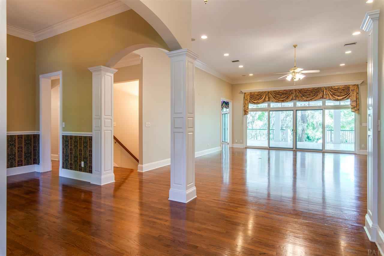 7636 Old Bay Pointe Road Milton, FL 32583 - Photo 20 of 50 View of Formal Dining & stairs leading to garage