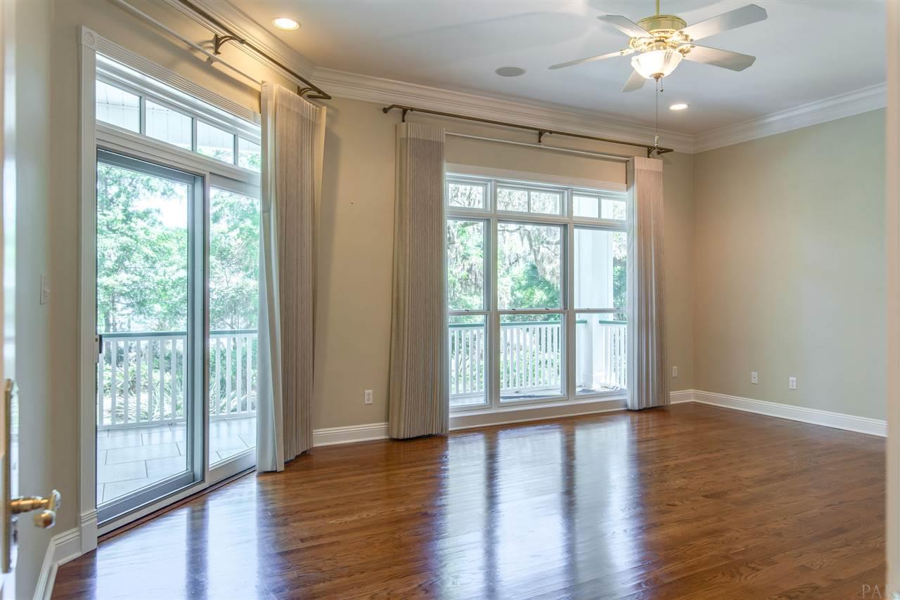 7636 Old Bay Pointe Road Milton, FL 32583 - Photo 26 of 50 Glass doors lead to large porch w/ views of garden