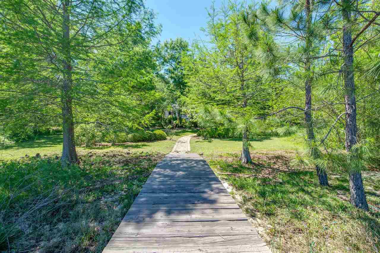 7636 Old Bay Pointe Road Milton, FL 32583 - Photo 5 of 50 Landscaping creates privacy, beauty, & peace
