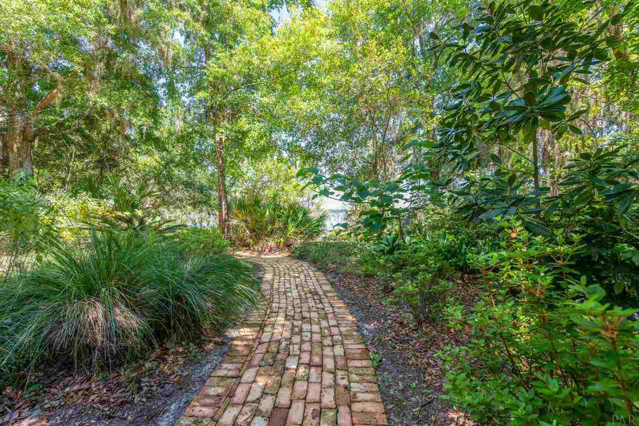 7636 Old Bay Pointe Road Milton, FL 32583 - Photo 7 of 50 Step into the enchanted garden with Majestic oaks