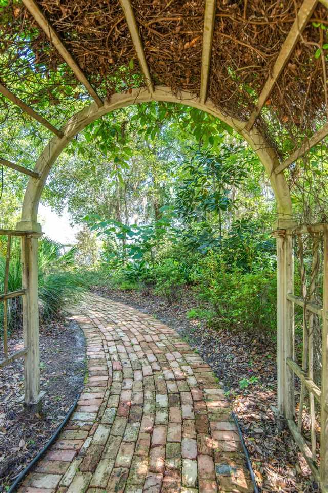 7636 Old Bay Pointe Road Milton, FL 32583 - Photo 8 of 50 Follow the brick walkway to peace & serenity