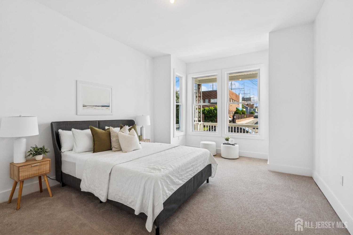 318 Seaman Street, Unit 1 New Brunswick, NJ 08901 - Photo 2 of 14 a spacious bedroom with a bed and window