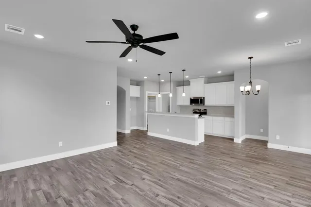 a kitchen with a sink stove and refrigerator
