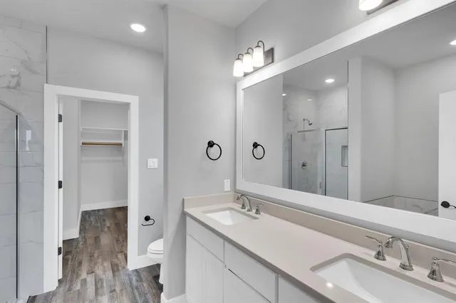 a view of hallway with wooden floor