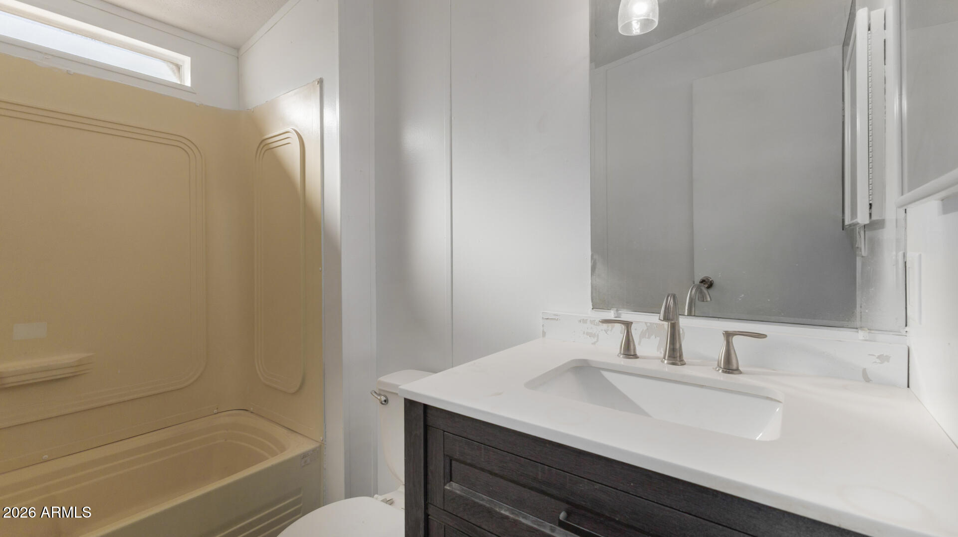 54073 West Stallion Road Maricopa, AZ 85139 - Photo 14 of 23 a bathroom with a sink and a mirror