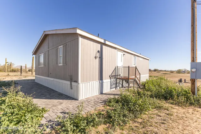 a view of a backyard of the house