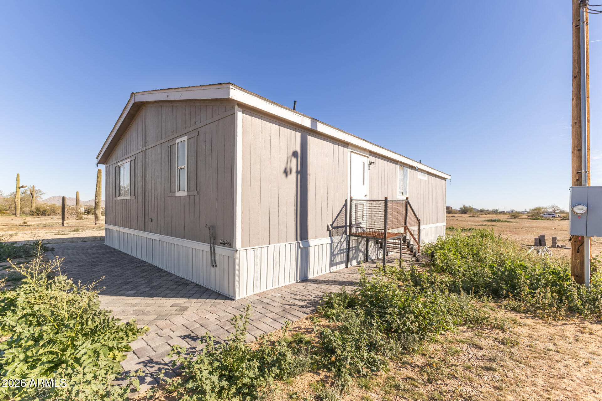 54073 West Stallion Road Maricopa, AZ 85139 - Photo 18 of 23 a view of a house with a yard