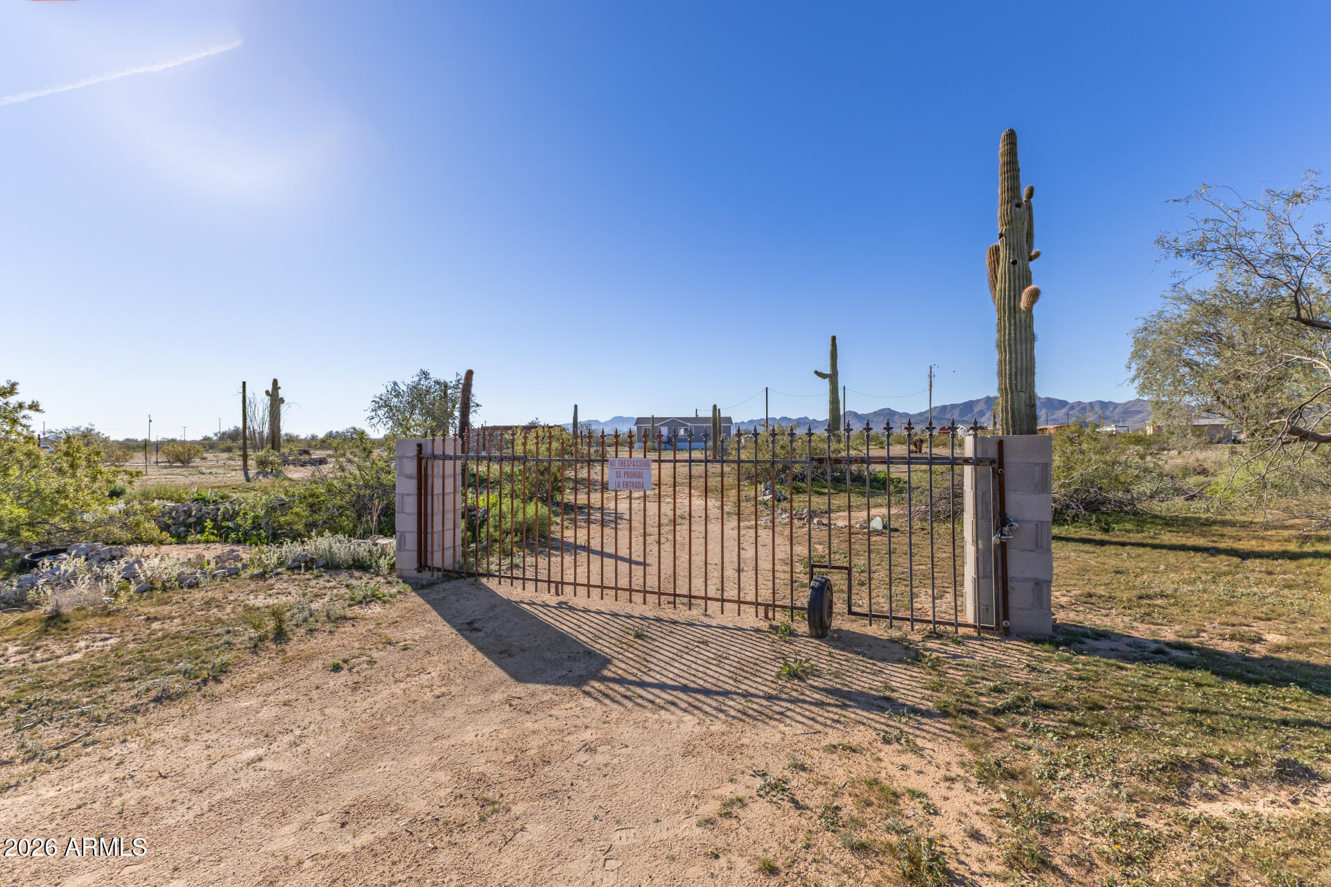 54073 West Stallion Road Maricopa, AZ 85139 - Photo 6 of 23 a view of a dry yard with wooden fence