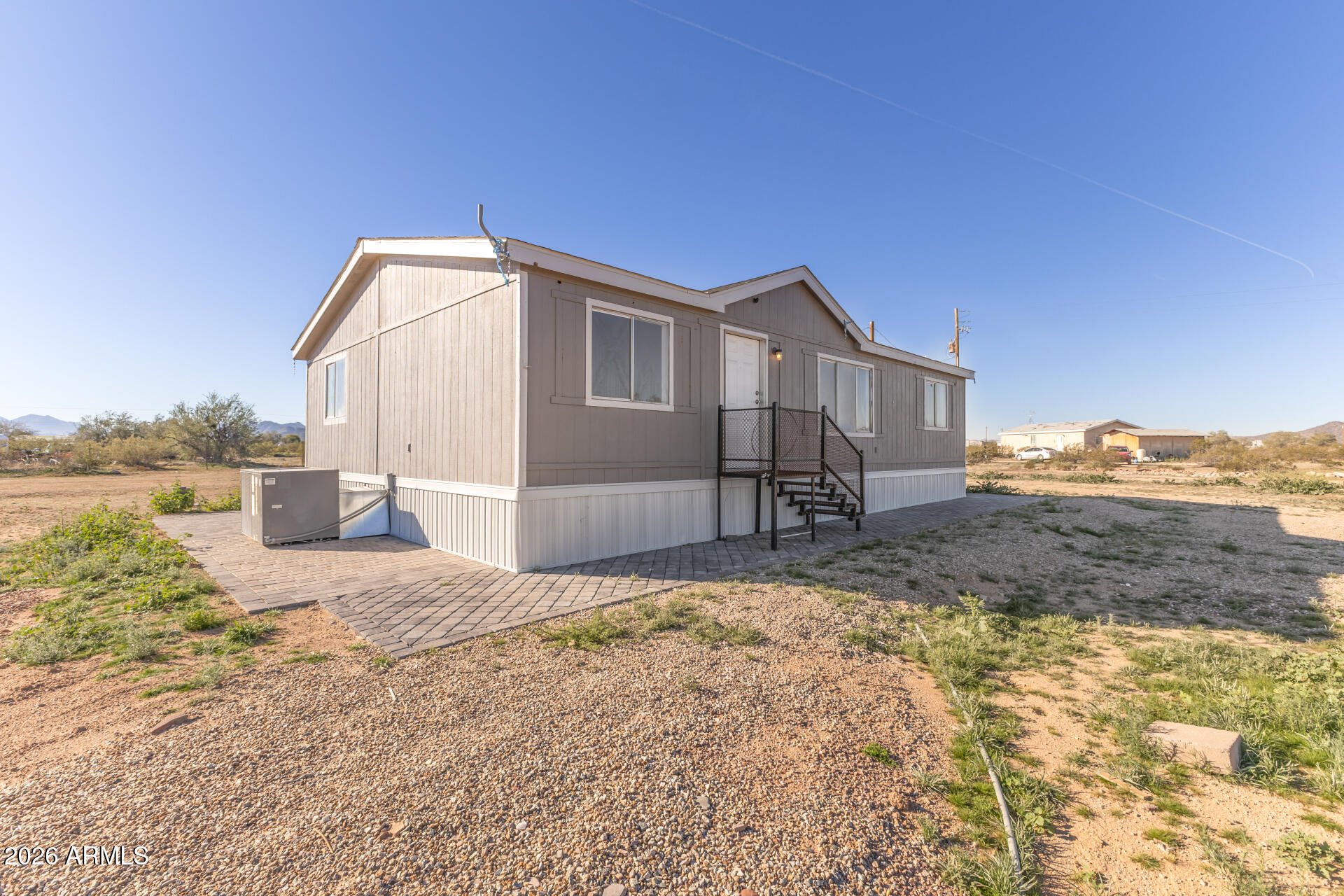 54073 West Stallion Road Maricopa, AZ 85139 - Photo 7 of 23 a front view of a house with a yard