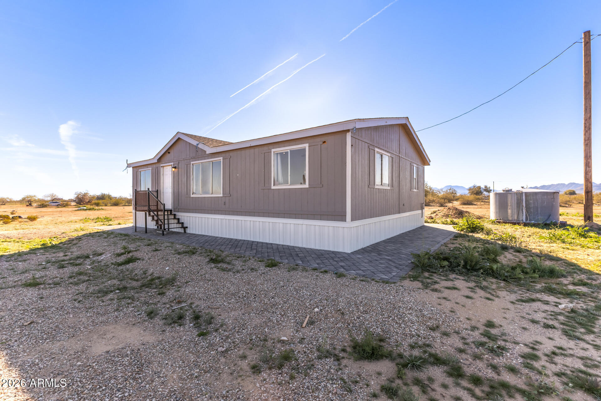 54073 West Stallion Road Maricopa, AZ 85139 - Photo 8 of 23 a view of a house with a yard