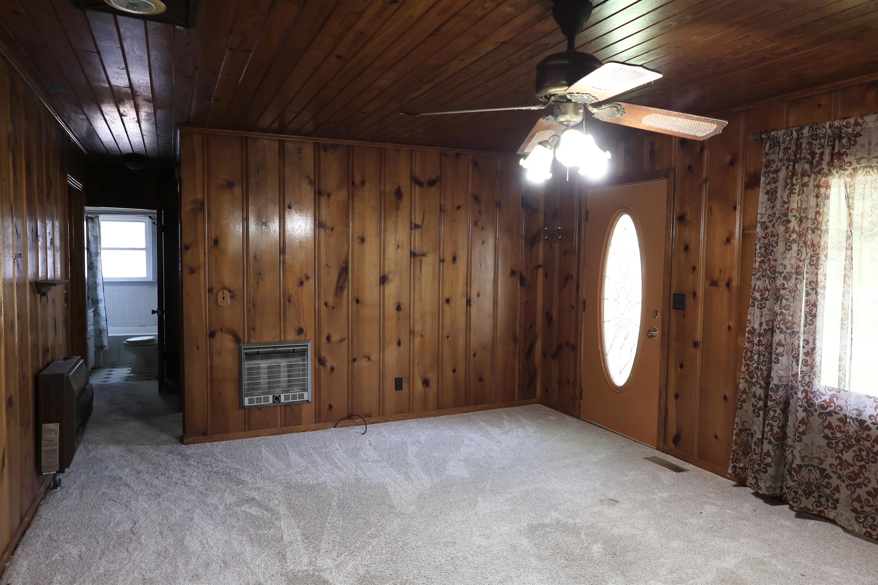 123 North Magnolia Street Adamsville, TN 38310 - Photo 16 of 25 a view of an empty room with a mirror