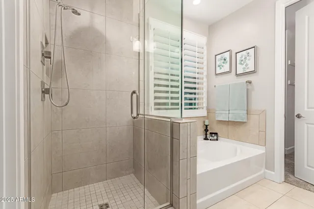 a bathroom with a bathtub and shower