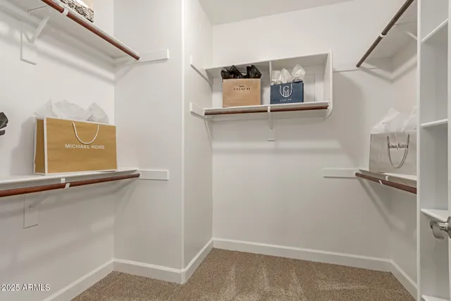 a view of a storage and utility room with washer and dryer