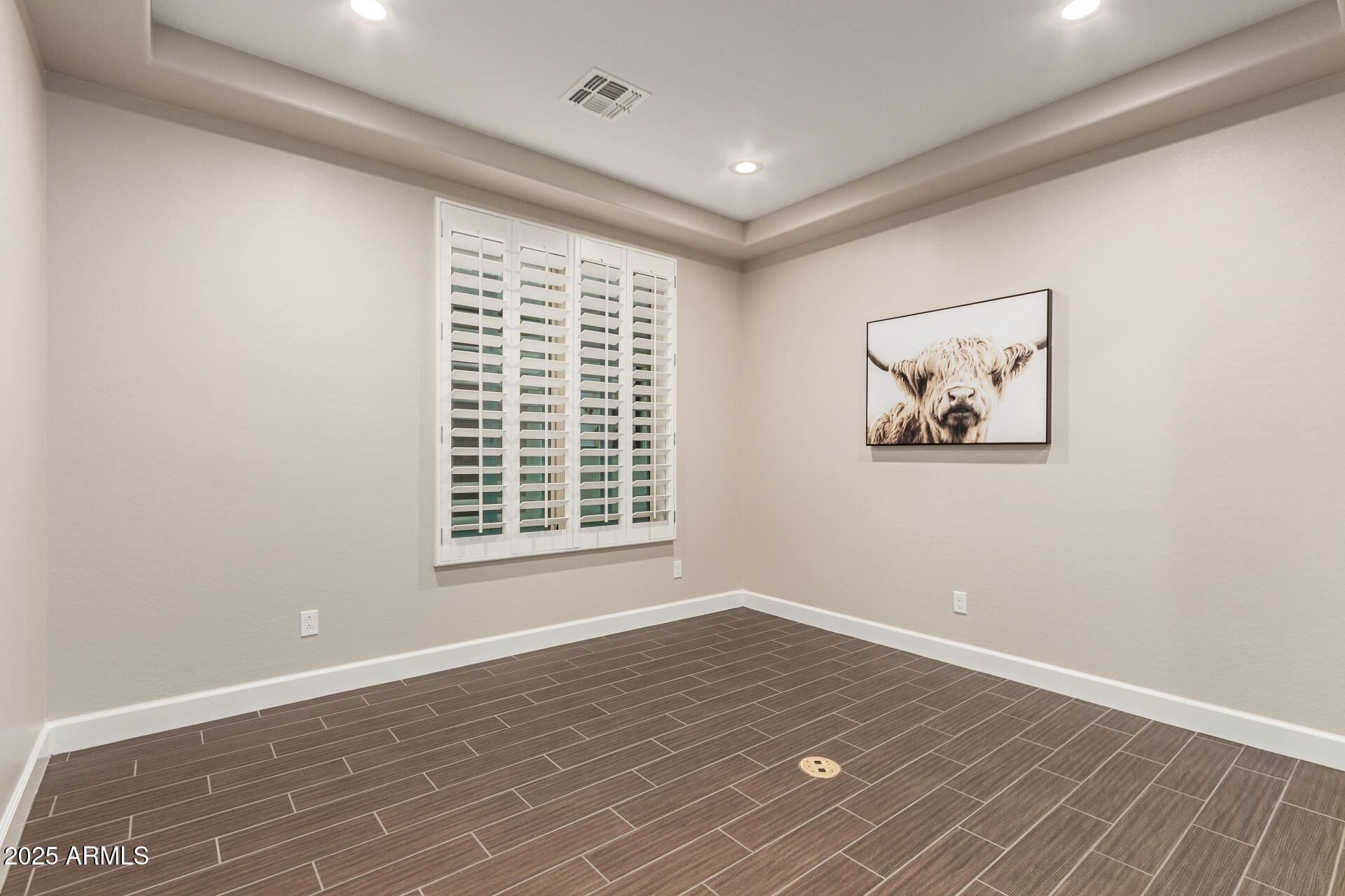 4312 East Rawhide Street Gilbert, AZ 85296 - Photo 19 of 24 a view of empty room with wooden floor and fan