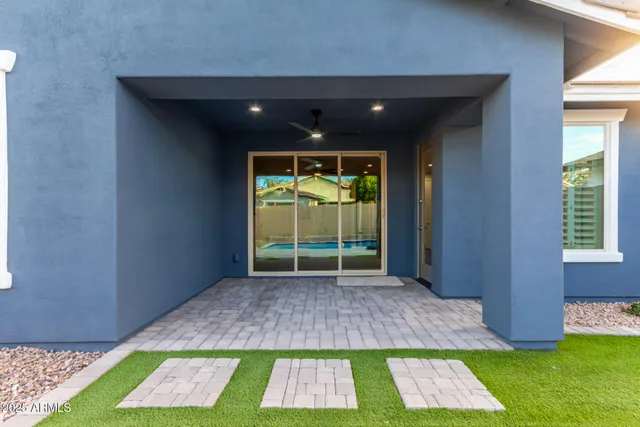 a view of backyard with a large window