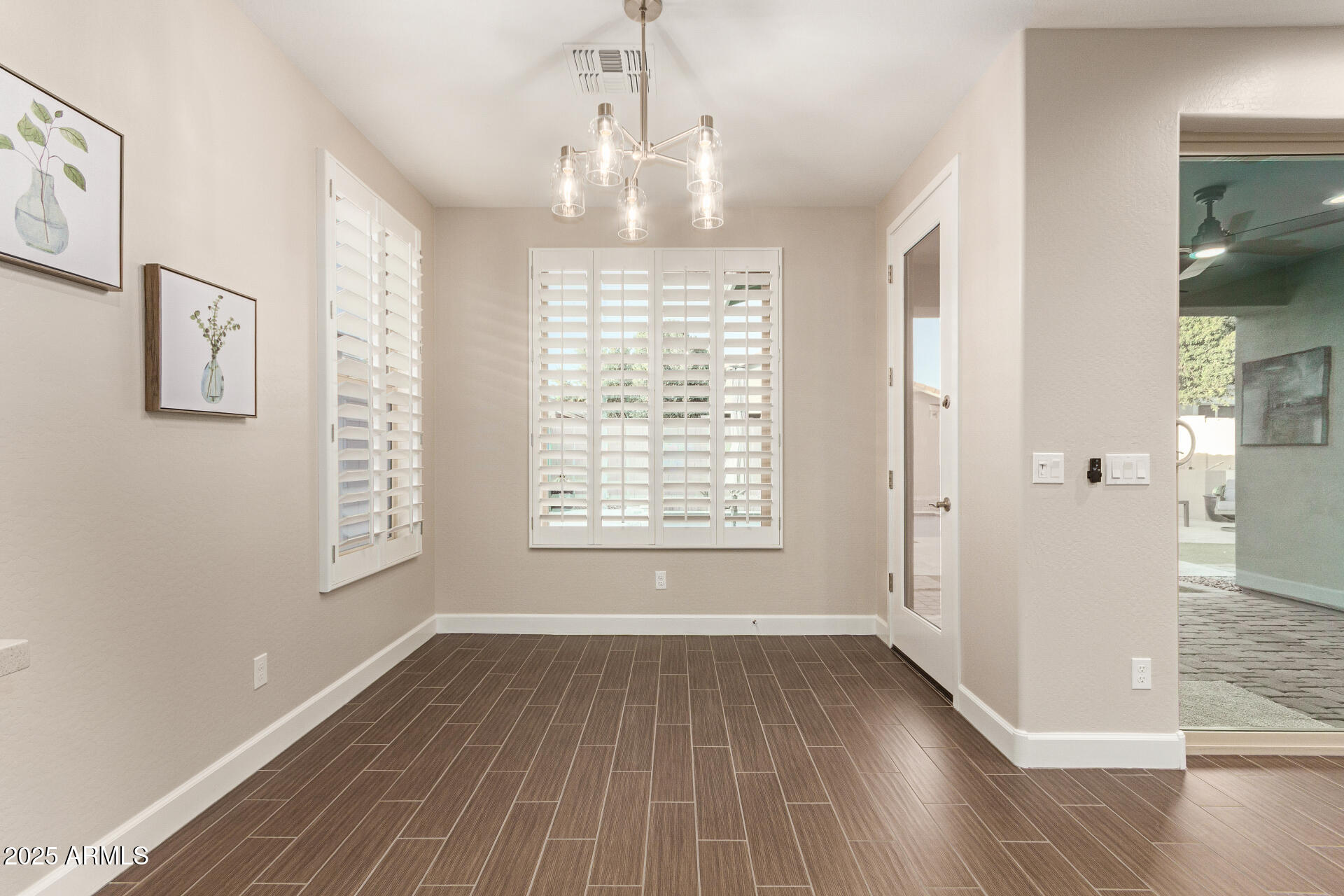 4312 East Rawhide Street Gilbert, AZ 85296 - Photo 10 of 24 a view of an empty room with wooden floor and a window