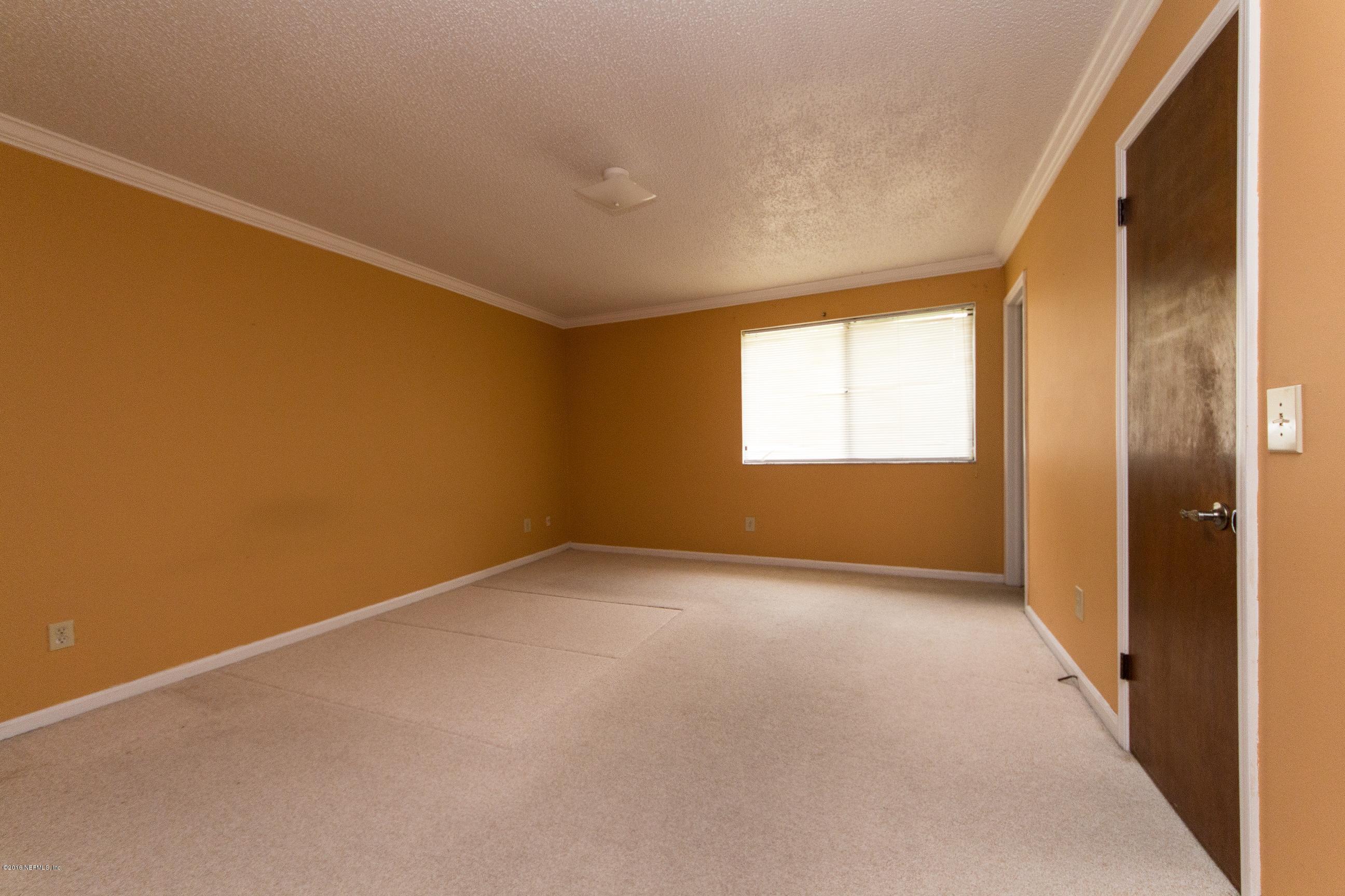 10852 Reading Road Jacksonville, FL 32257 - Photo 16 of 30 an empty room with windows