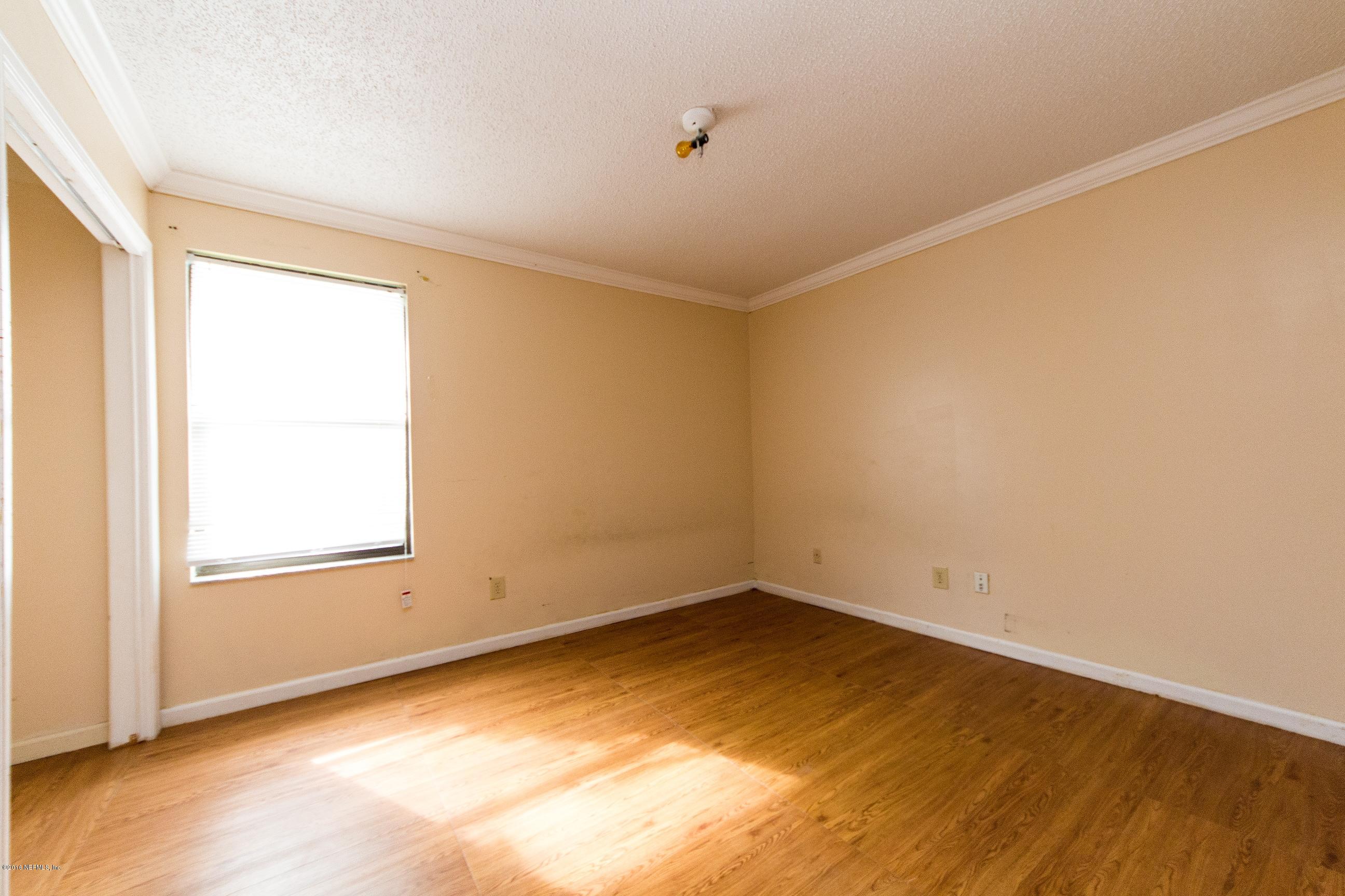 10852 Reading Road Jacksonville, FL 32257 - Photo 19 of 30 an empty room with a empty space and a window