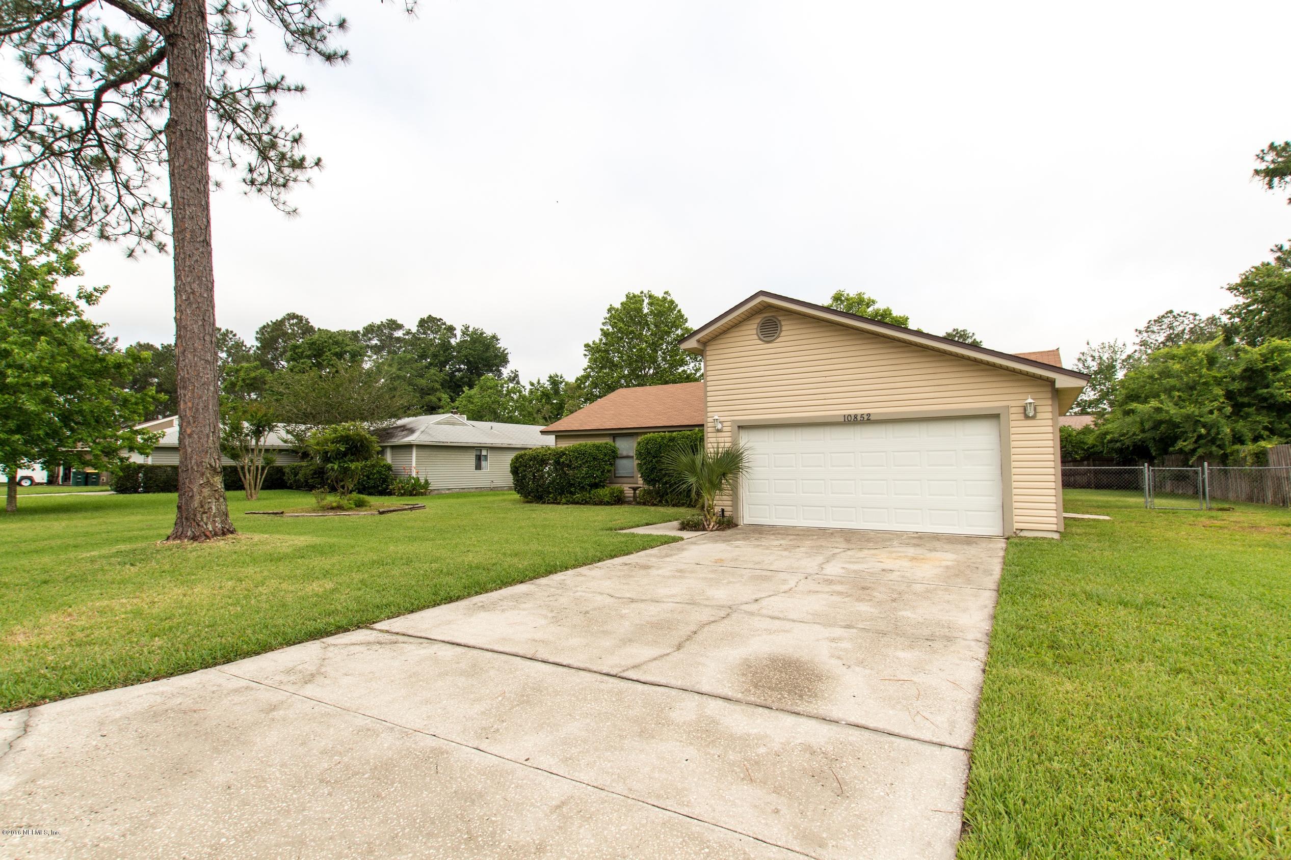 10852 Reading Road Jacksonville, FL 32257 - Photo 2 of 30 a view of a house with a yard