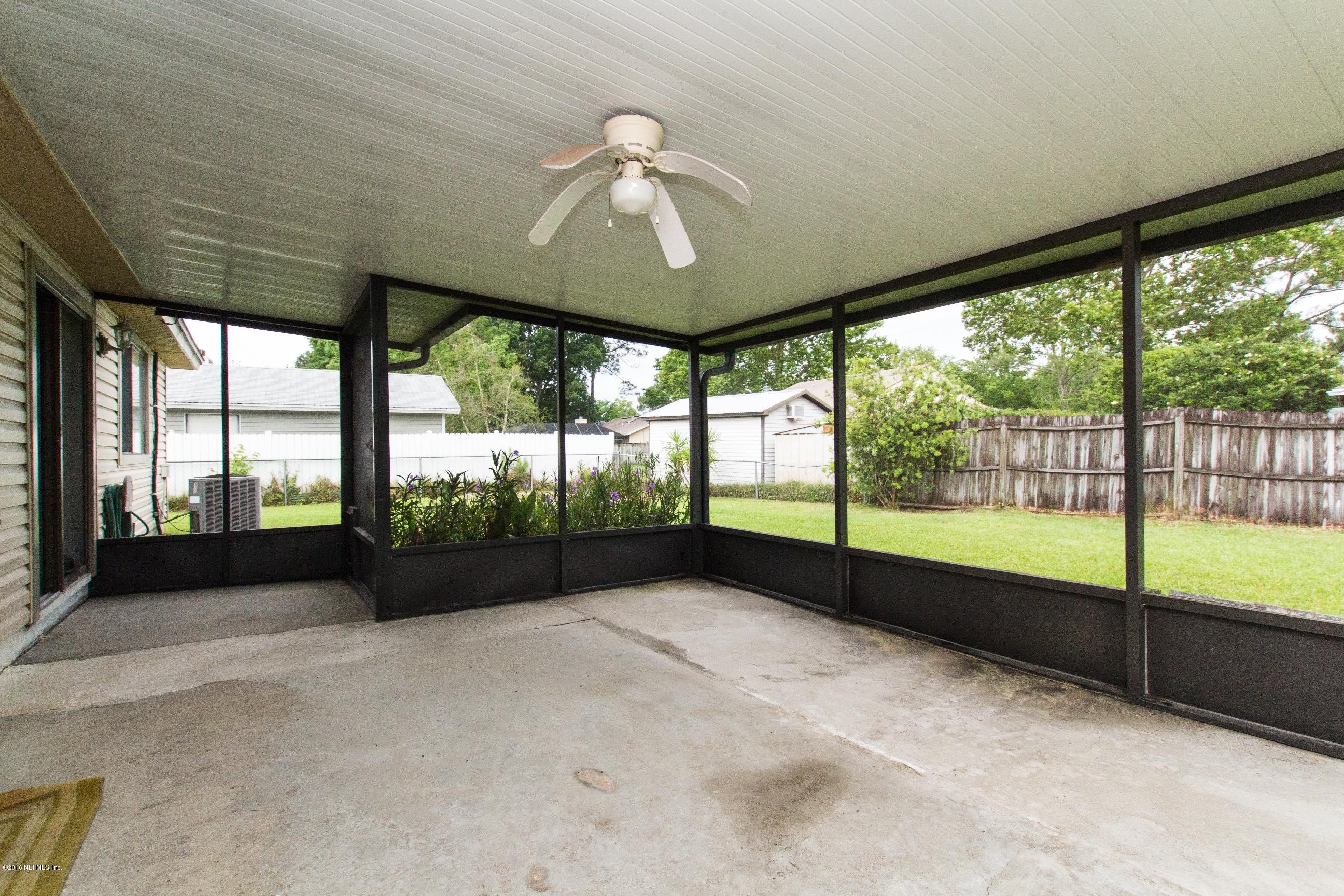 10852 Reading Road Jacksonville, FL 32257 - Photo 22 of 30 a view of room with window and a ceiling fan