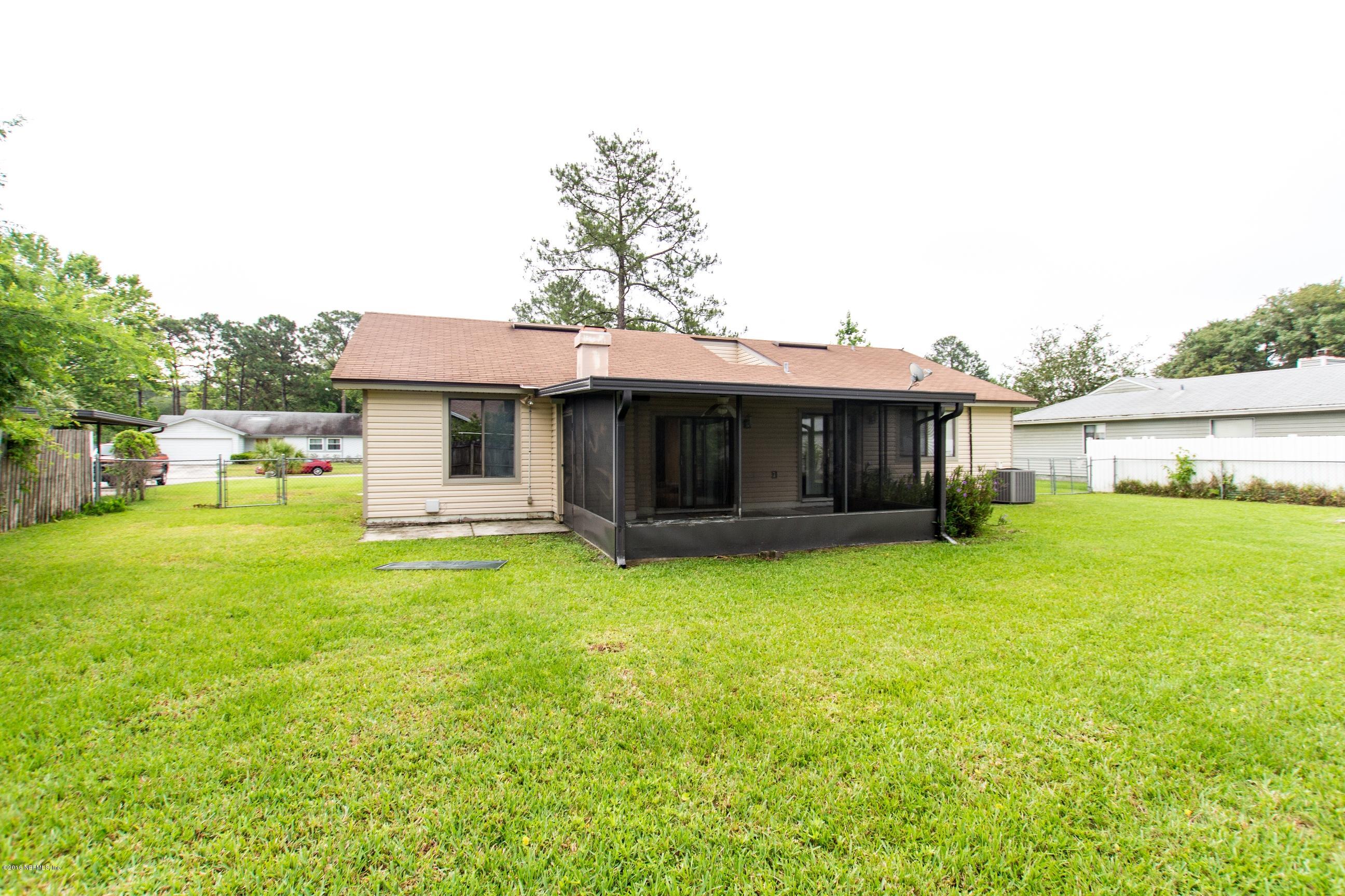 10852 Reading Road Jacksonville, FL 32257 - Photo 28 of 30 a front view of a house with a garden