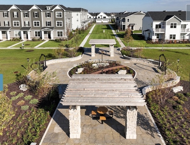4189 Chelsea Manor Circle Aurora, IL 60504 - Photo 17 of 19 a view of yard with swimming pool and outdoor seating