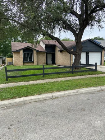 a small green house in middle of the forest