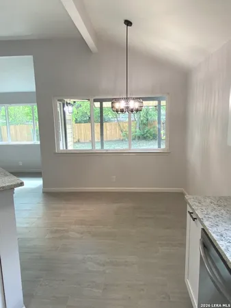 an empty room with wooden floor