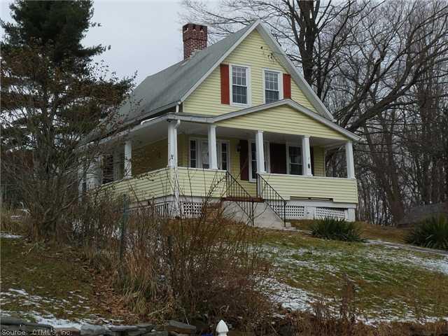 45 Mountain Road Simsbury, CT 06081 - Photo 1 of 1 a view of a white house with large windows and a small yard