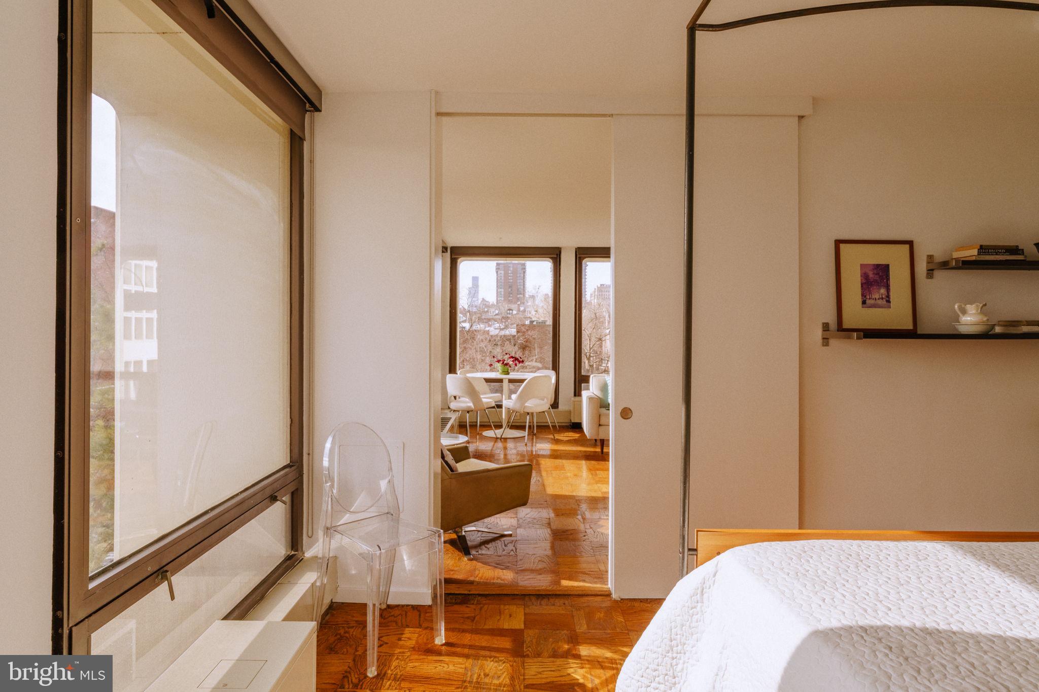 220 Locust Street, Unit 2GS Philadelphia, PA 19106 - Photo 17 of 42 a bedroom with a bed and glass door