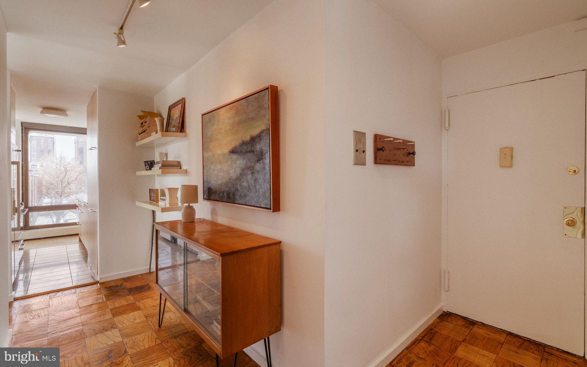 220 Locust Street, Unit 2GS Philadelphia, PA 19106 - Photo 21 of 42 a room with furniture and wooden floor