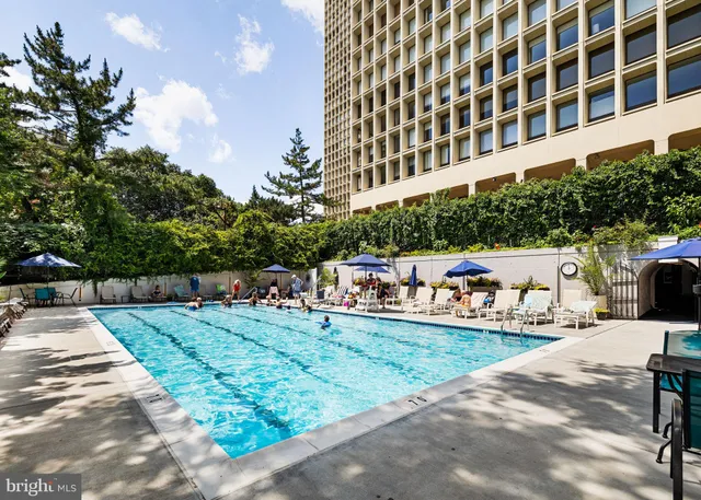 a view of a house with a tree and pathway