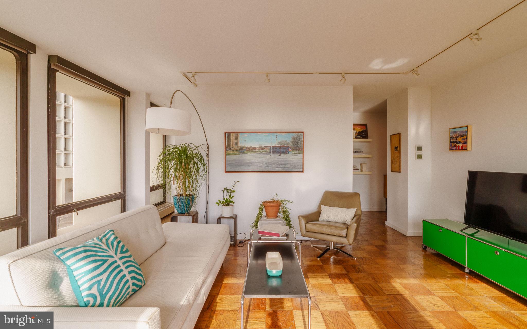 220 Locust Street, Unit 2GS Philadelphia, PA 19106 - Photo 3 of 42 a living room with furniture and a flat screen tv