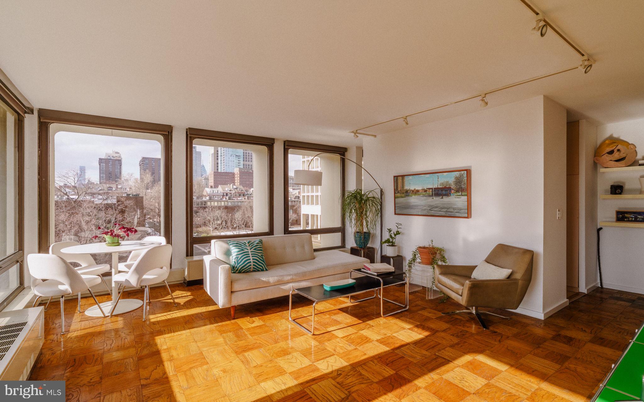220 Locust Street, Unit 2GS Philadelphia, PA 19106 - Photo 4 of 42 a living room with furniture and a floor to ceiling window