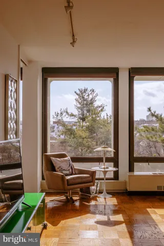 a living room with couch and a large window