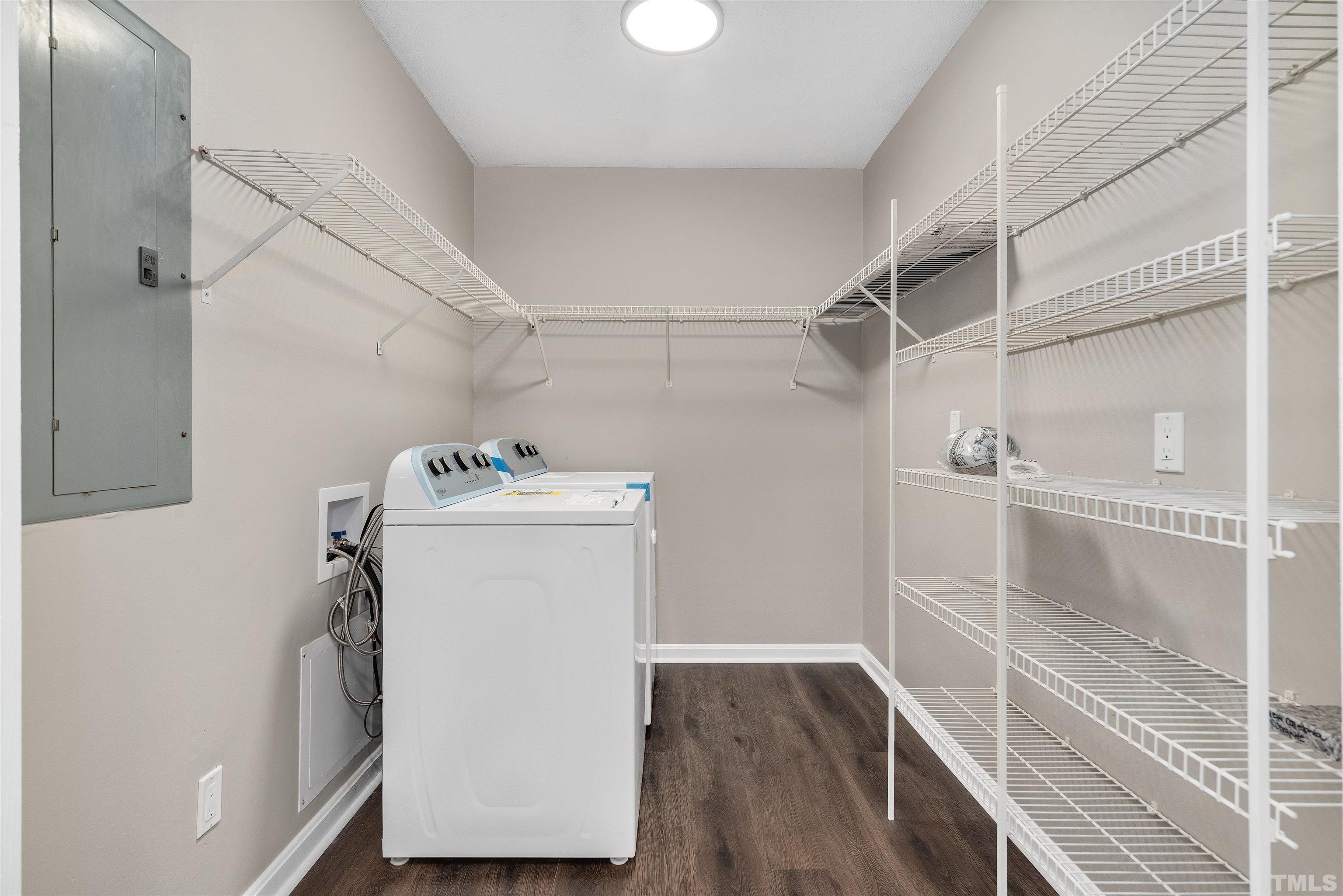 5630 Fairground Road Dunn, NC 28334 - Photo 14 of 33 a utility room with wooden floor washer and dryer
