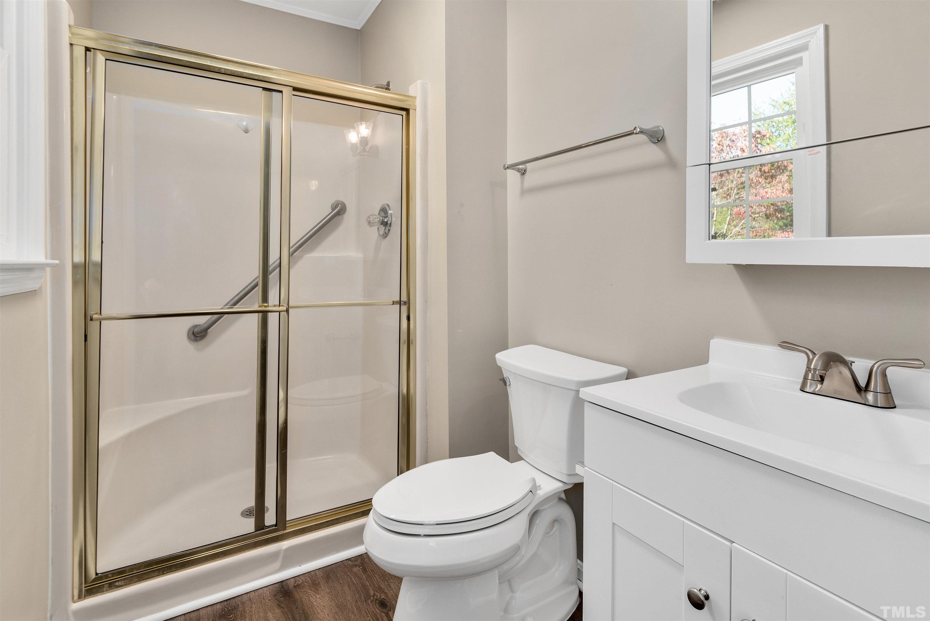 5630 Fairground Road Dunn, NC 28334 - Photo 23 of 33 a bathroom with a sink toilet and shower